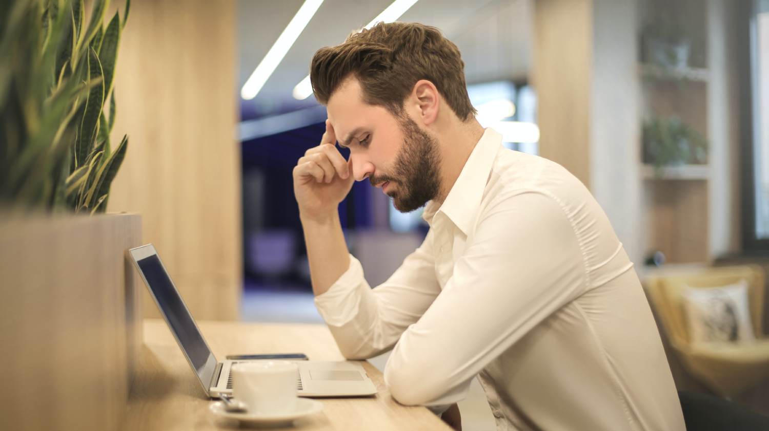 Man sitting Infront of Laptop